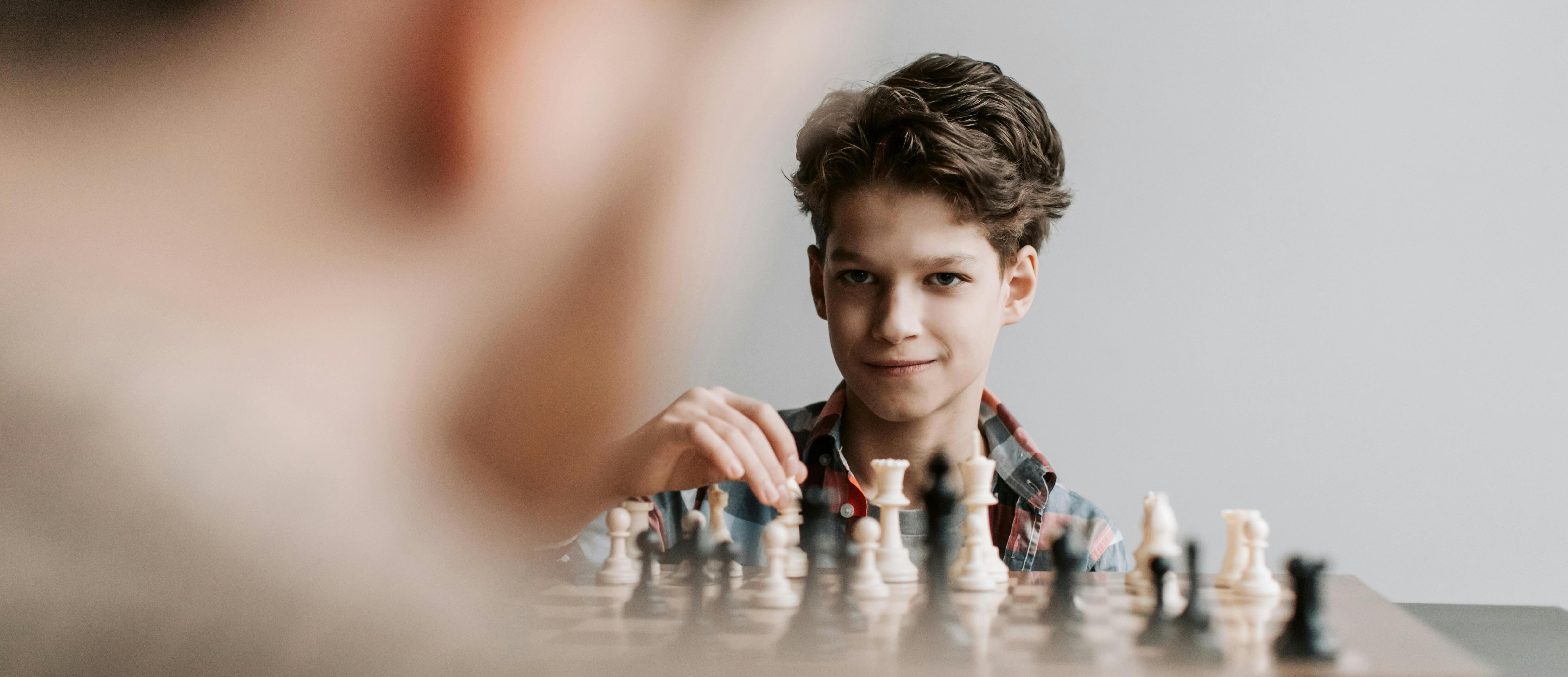 Boy playing chess